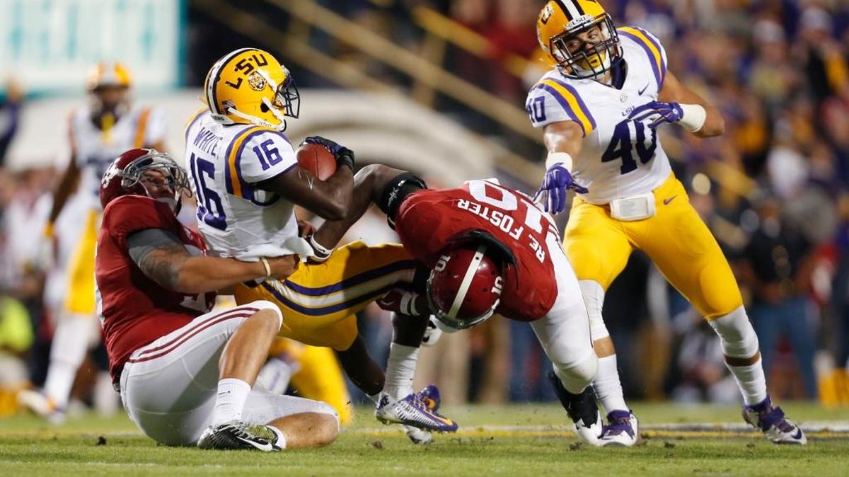 In this file photo from Nov. 8, 2014, LSU returner Tre’Davious White is tackled by Alabama linebacker Reuben Foster (10) in the first half in Baton Rouge, La.