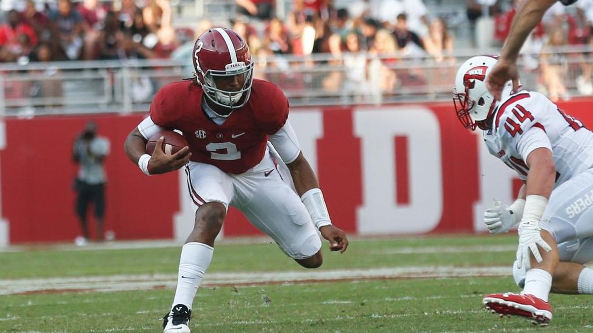 Alabama quarterback Jalen Hurts runs the ball during the second half of an NCAA college football game against Western Kentucky on Saturday in Tuscaloosa, Ala.
