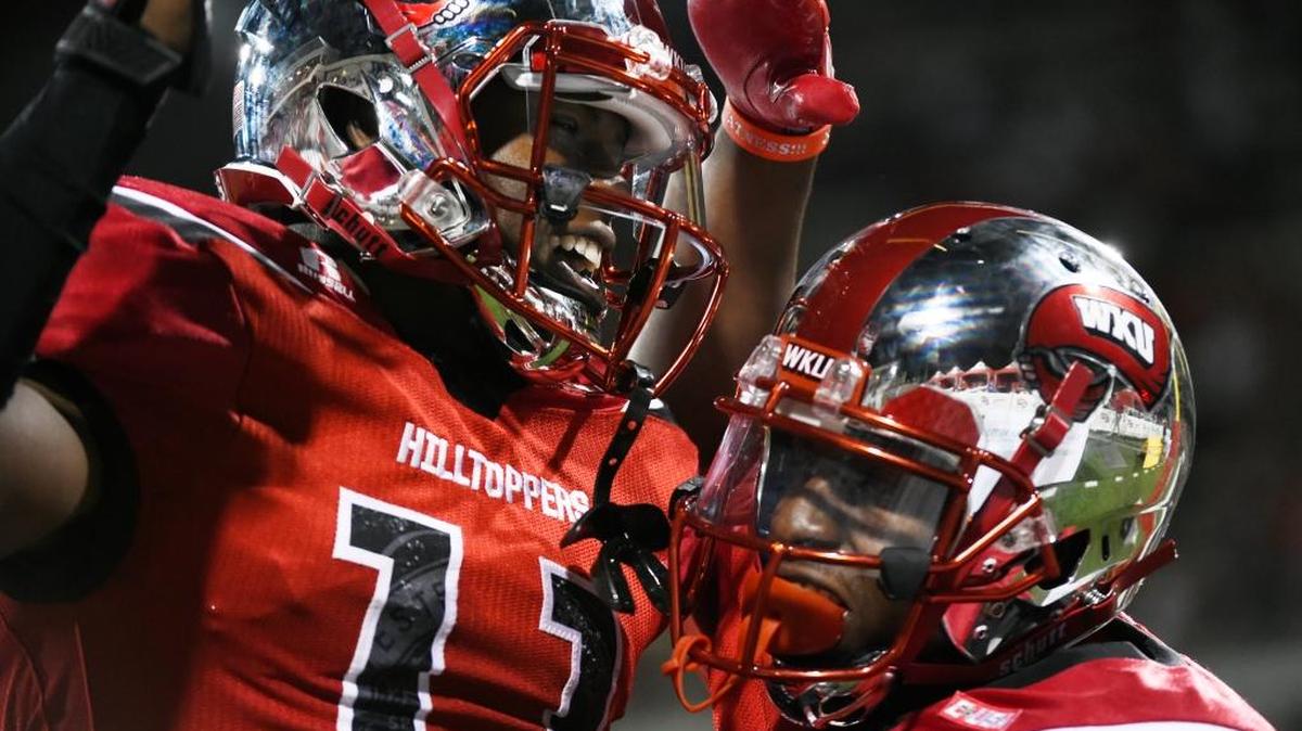 Western Kentucky wide receiver Lucky Jackson (11) celebrates with a teammate after scoring a touchdown against Rice on Sept. 1 in Bowling Green, Ky. Western Kentucky won 46-14.