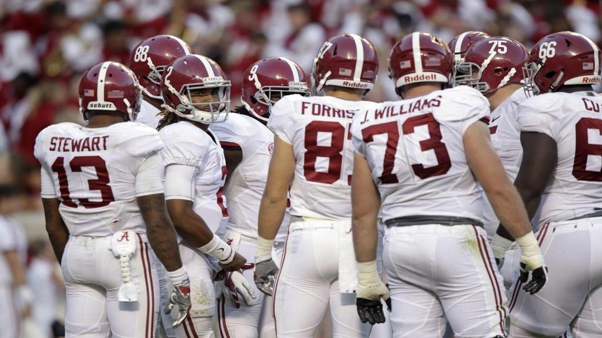 Alabama quarterback Jalen Hurts, looking back toward the bench, huddles with the offense during the second half against Tennessee on Oct. 15 in Knoxville, Tenn.