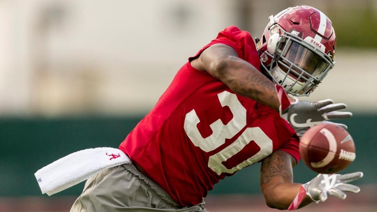 Alabama linebacker Mack Wilson looks to make a catch during practice on Monday.
