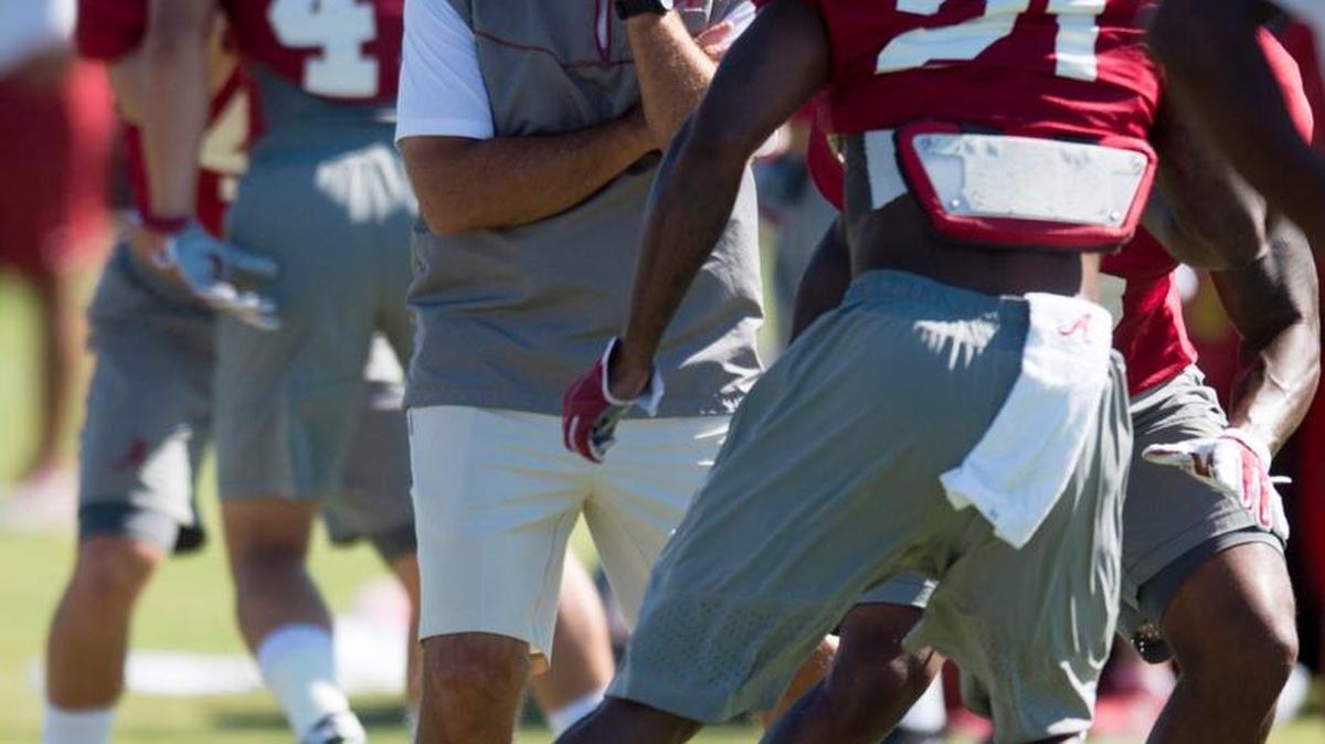 Alabama coach Nick Saban watches defensive back Maurice Smith (21 during practice in August 2015.
