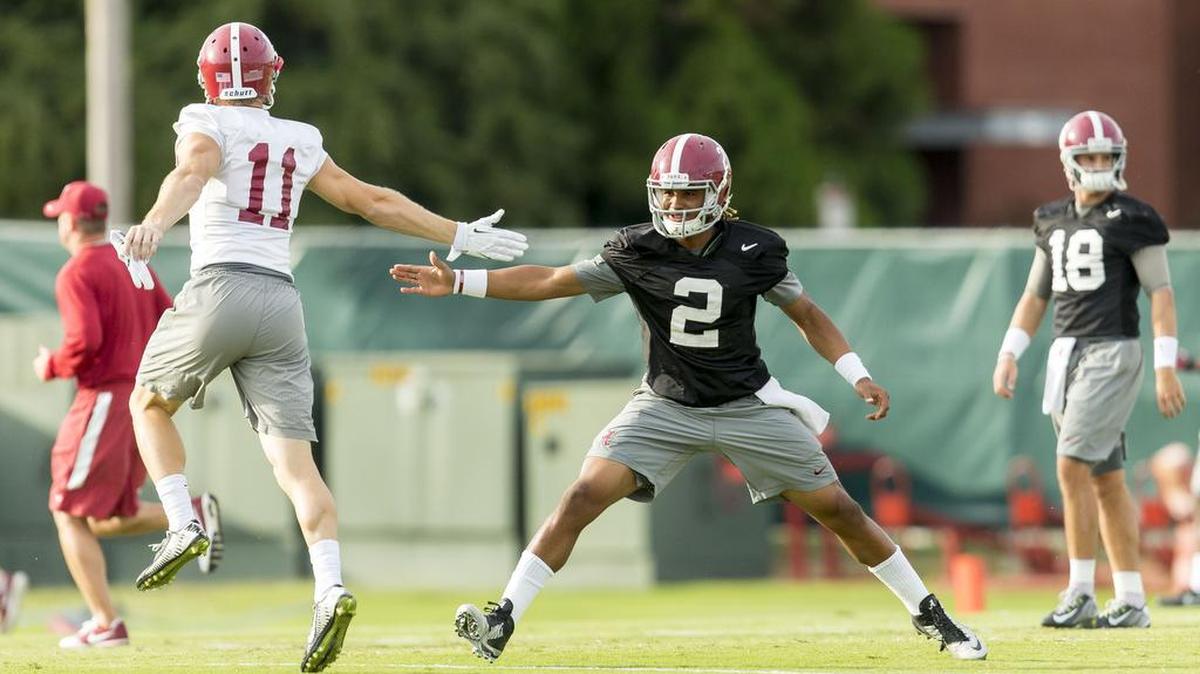 Alabama wide receiver Gehrig Dieter (11) and Alabama quarterback Jalen Hurts (2) greet each other between drills during Alabama practice Monday at the Thomas-Drew Practice Fields in Tuscaloosa, Ala.