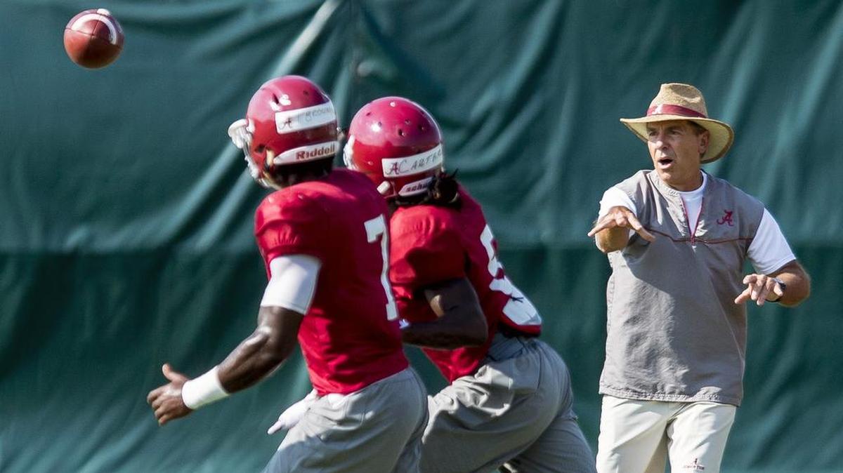 Alabama coach Nick Saban works with his players during football practice Aug. 27 at the Hank Crisp Indoor Facility in Tuscaloosa, Ala.