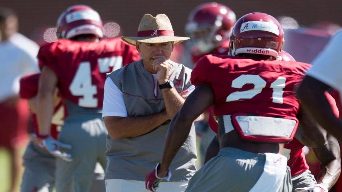 Alabama coach Nick Saban tracks his players, including defensive back Maurice Smith (21), during football practice Aug. 25, 2015, in Tuscaloosa, Ala.