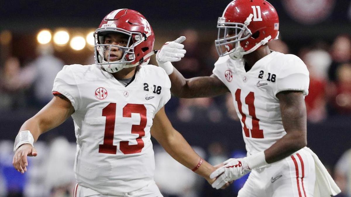Alabama quarterback Tua Tagovailoa congratulates Henry Ruggs III (11) after his touchdown catch during the second half of the NCAA college football playoff championship game against Georgia, Monday, Jan. 8, 2018, in Atlanta. (AP Photo/David J. Phillip)
