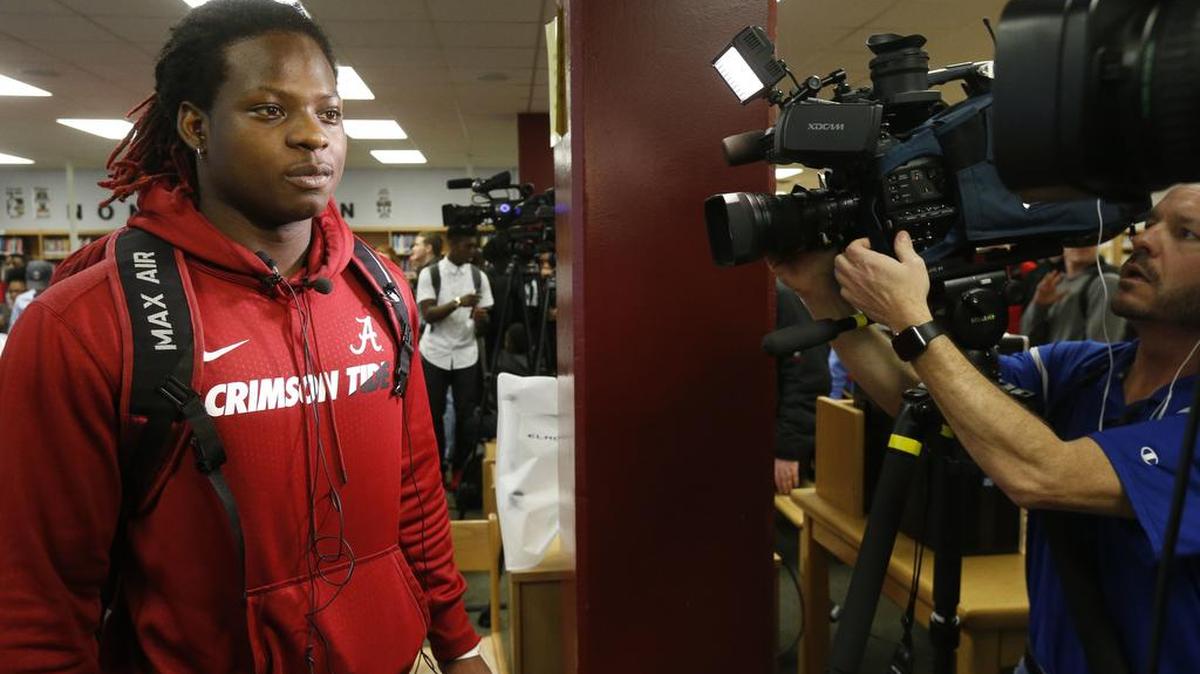 Hillcrest High School running back Brian Robinson wears a University of Alabama sweatshirt as he gets set to speak with the media after committing to the Crimson Tide on national signing day, Wednesday, Feb. 1, 2017, in Tuscaloosa, Ala.
