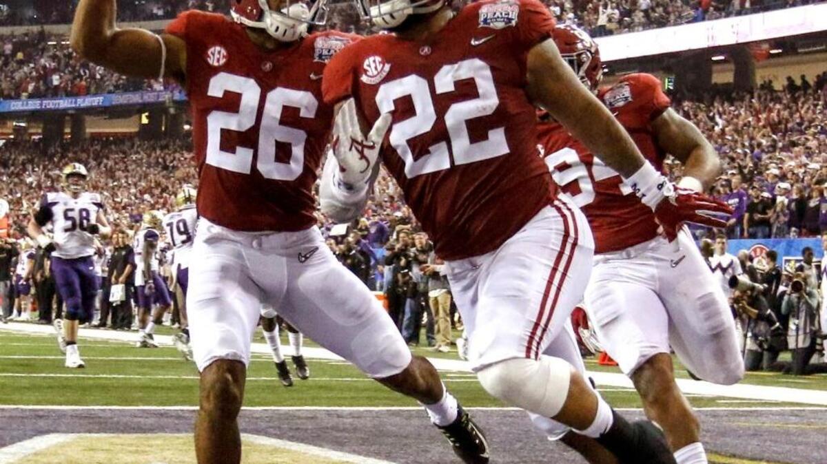 Alabama linebacker Ryan Anderson (22) celebrates with Alabama defensive back Marlon Humphrey (26) after scoring a touchdown on an interception return during the first half of the Peach Bowl on Saturday in Atlanta.