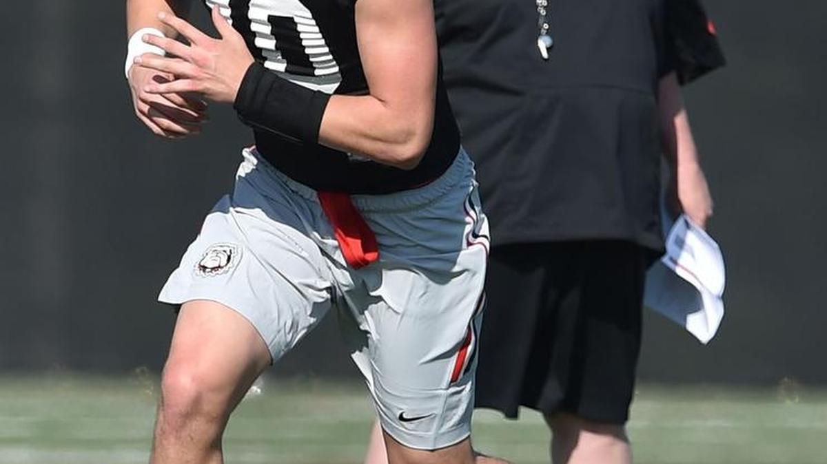 Georgia offensive coordinator Jim Chaney gives freshman quarterback Jacob Eason feedback March 15 during spring practice in Athens, Ga.