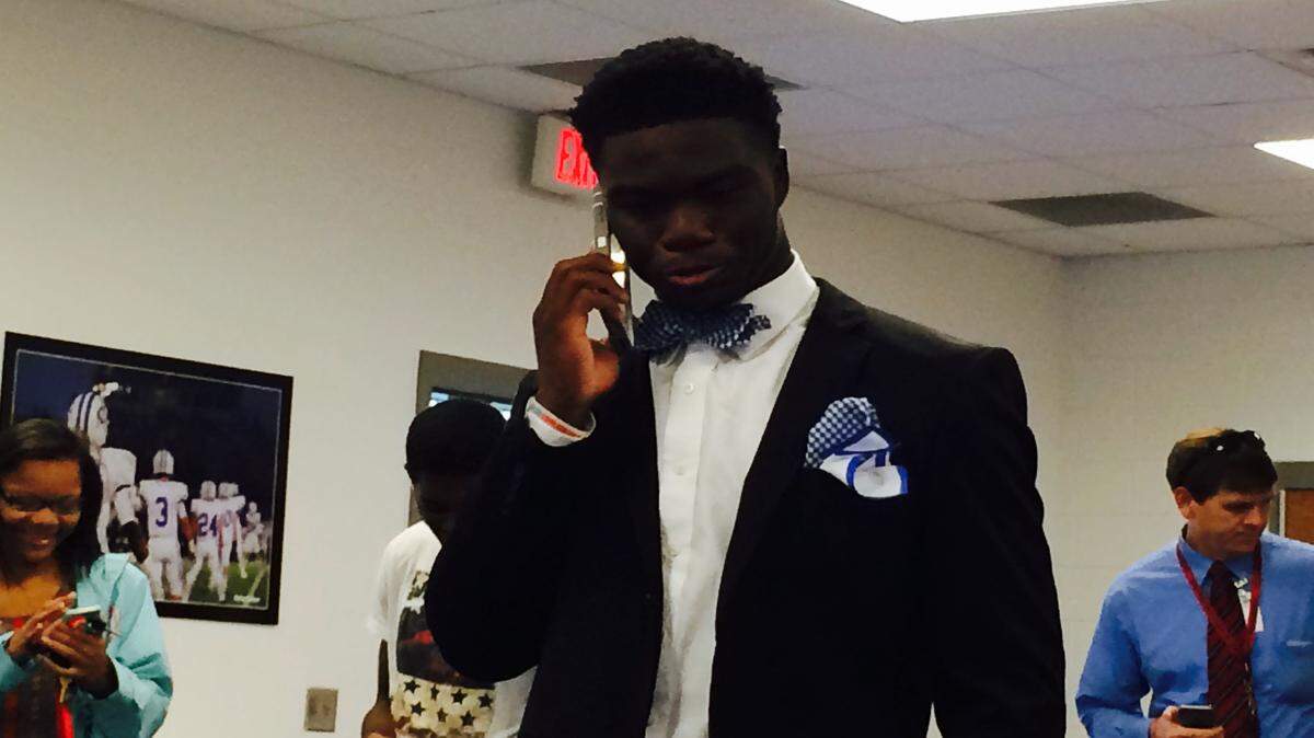 Oconee County linebacker Jaleel Laguins speaks with Georgia coach Mark Richt on the phone following his commitment to the Bulldogs. 