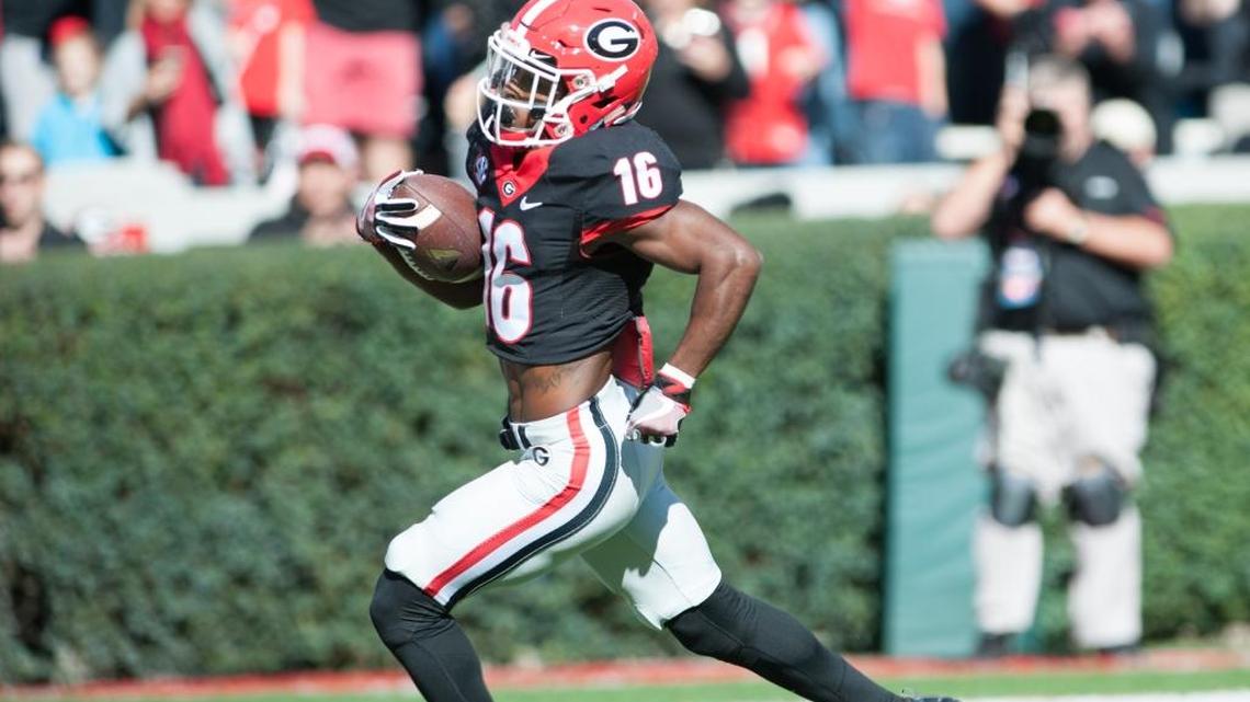 Isaiah McKenzie runs for one of his two touchdowns against Louisiana-Lafayette.