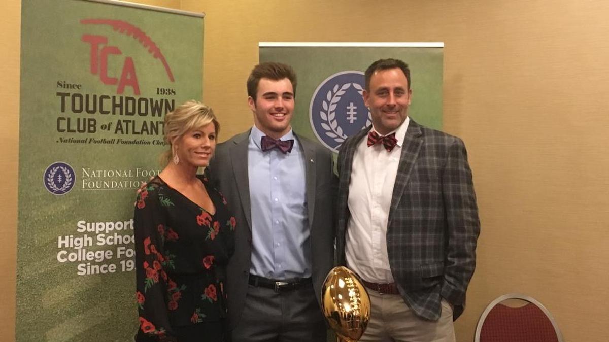 Jake Fromm poses for a photo with his parents, Lee Fromm and Emerson Fromm, at the Touchdown Club of Atlanta awards banquet in Tucker, Georgia.