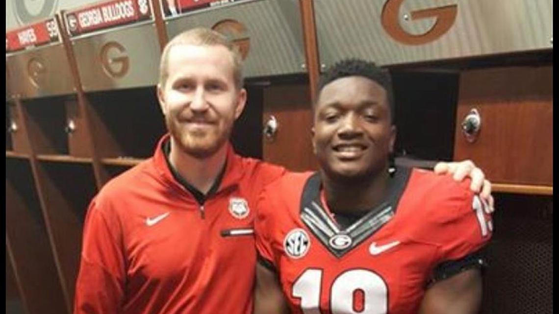 Mikel Jones poses for a photo with UGA inside linebackers coach Glenn Schumann.
