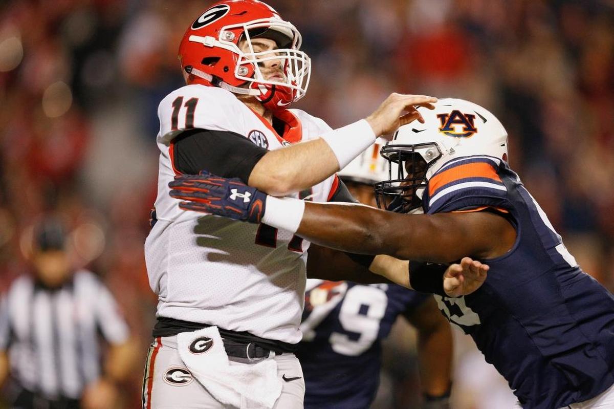 Auburn’s K.J. Britt, right, is ranked the number four inside linebacker in the country by the 2020 Phil Steele College Football Preview.