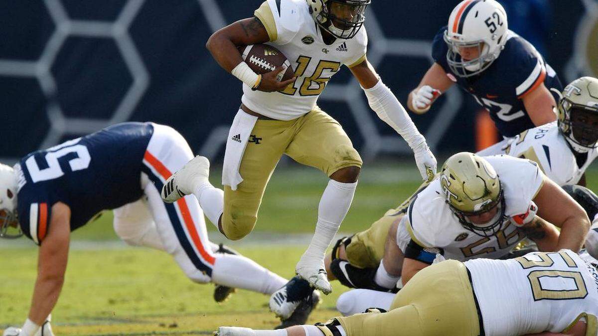 Georgia Tech quarterback TaQuon Marshall (16) runs out of the pocket against Virginia during the first half of their game Nov. 17 in Atlanta.