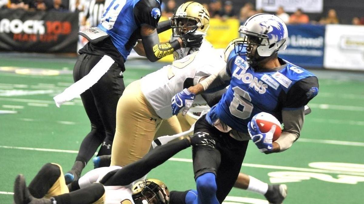 Columbus’ Jarmon Fortson spins out of the grasp zone of Michigan’s Corey Edwards during the 2016 AIF Championship. 
