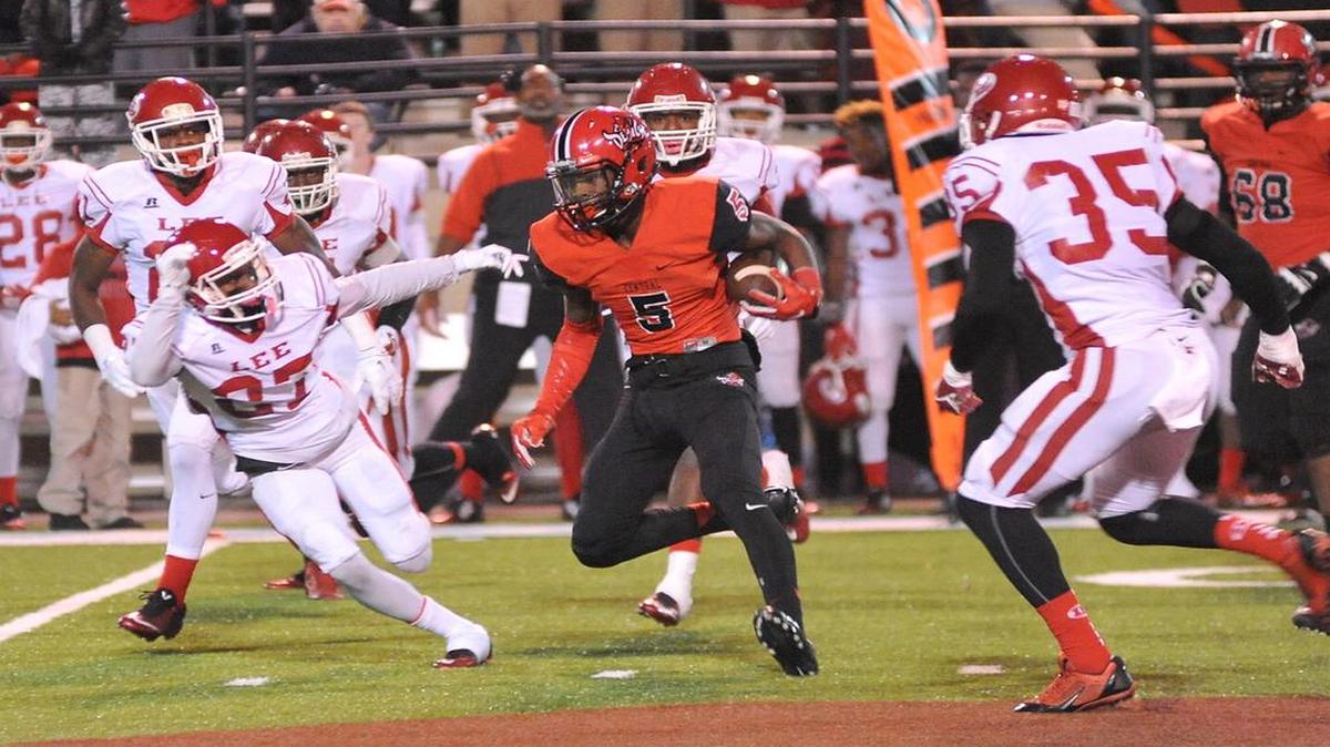 Central's Justyn Ross with a pass reception and carry for 8 yards against the Lee defenders Friday night at Garrett Harrison Stadium.