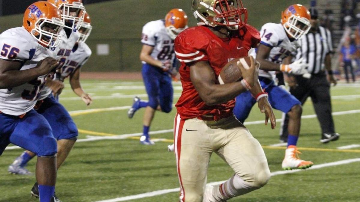 Hardaway High running back Marco Lee breaks loose for a long touchdown run against Columbus High during the Hawks Sept. 22 Homecoming game at Kinnett Stadium.