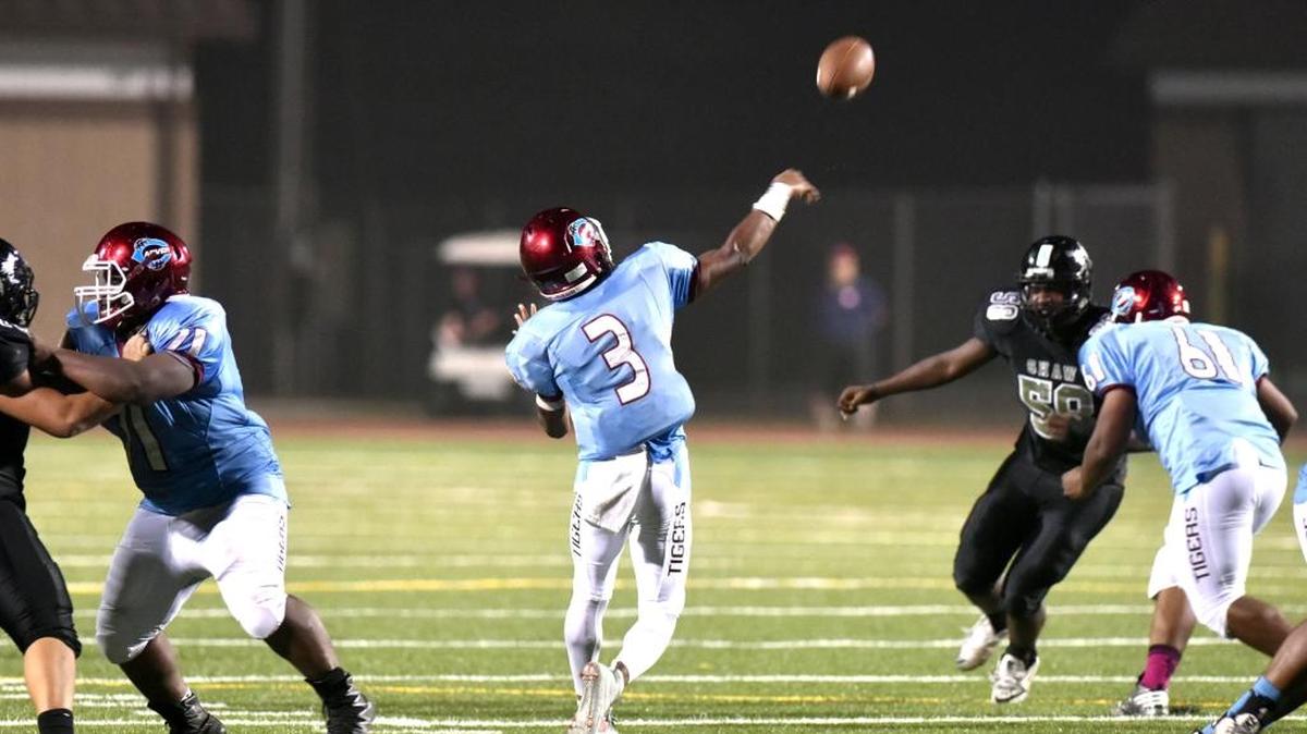 After a turnover on downs with nine seconds left in the first half, Carver's Desmond Whitlock throws a 58-yard pass to Jarius Thomas for Carver's 5th touchdown against Shaw Thursday night, September 28, 2017