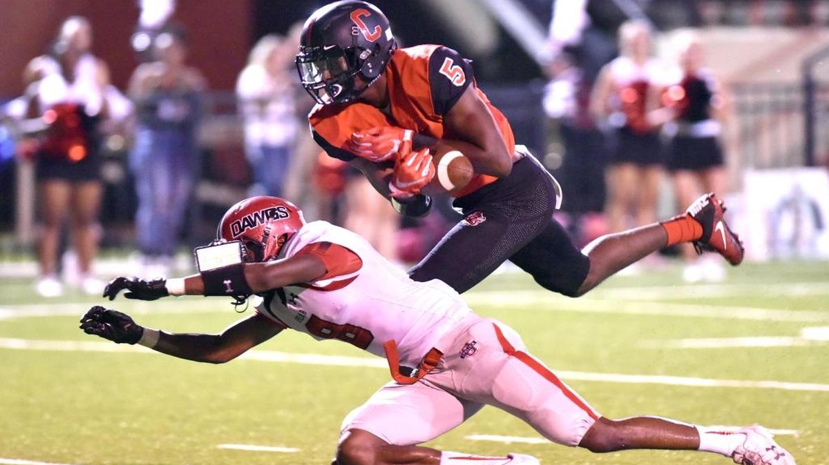Central wide receiver Justyn Ross reels in a 43-yard touchdown reception in the Red Devils' victory over Opelika on September 29, 2017.
