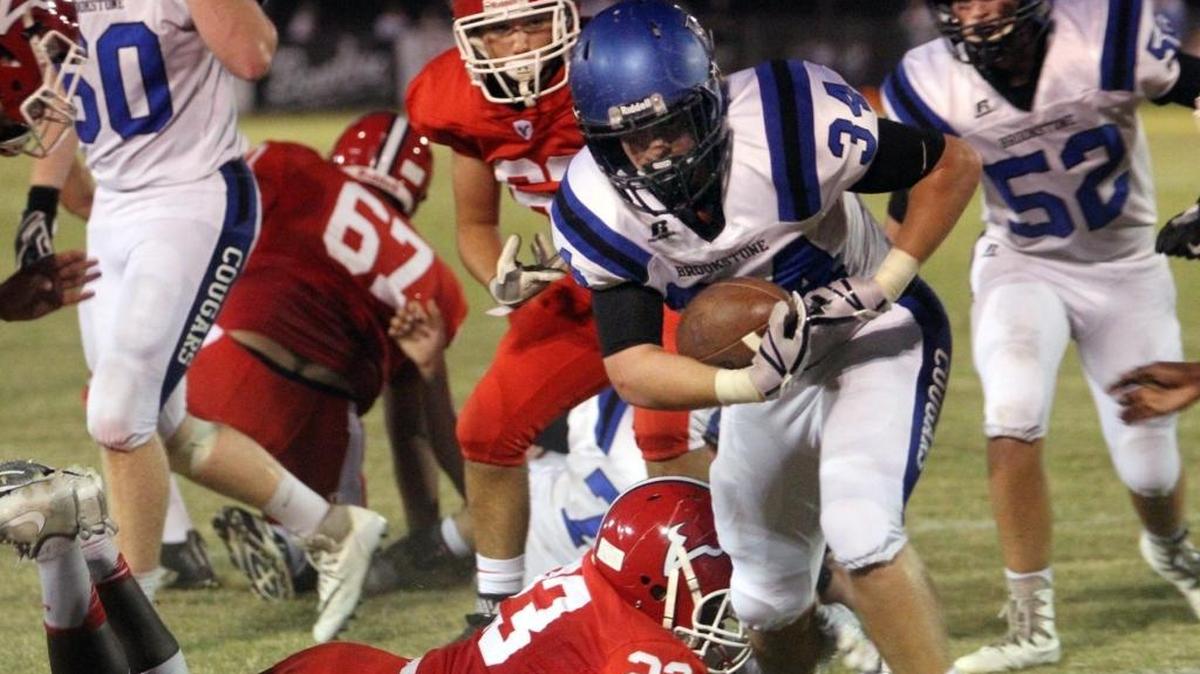 Brookstone’s Richard Hill breaks a tackle attempt by Pacelli's Justin Jackson to score in the first half of the Cougars and Vikings’ showdown on September 29, 2017