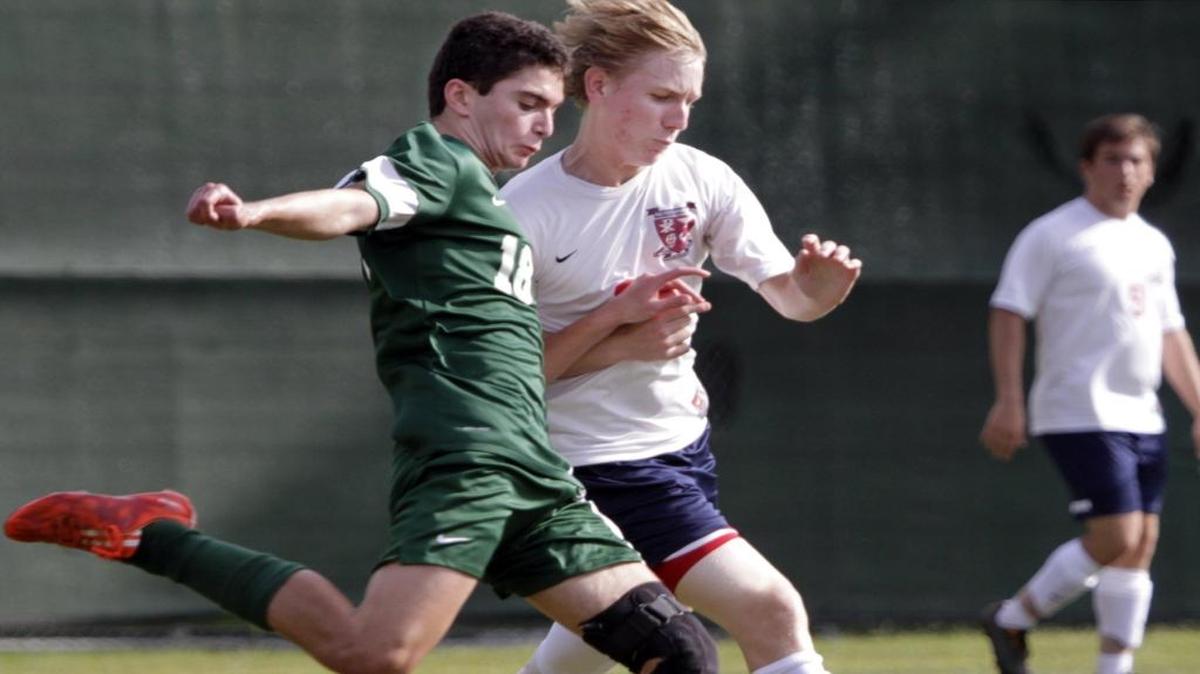 Pacelli’s Austin Zeruto battles Savannah Day School’s David DeVaro for the ball in the second round in GHSA Class A soccer.