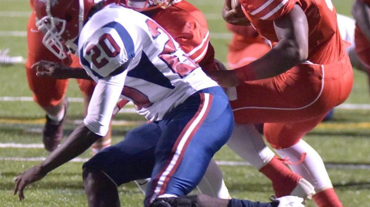 In this 2016 photo, Hardaway's Marco Lee spins past Westover's Jaron Moore tackle at the goal line and backs into the end zone at Kinnett Stadium.