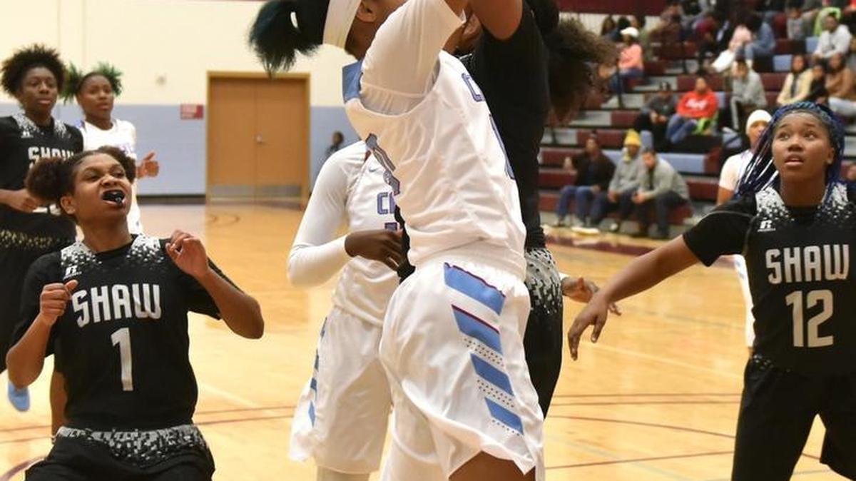 Carver's Mariah Igus is fouled by Shaw's Jerica Jackson as she went to the basket Friday night, December 15, 2017.