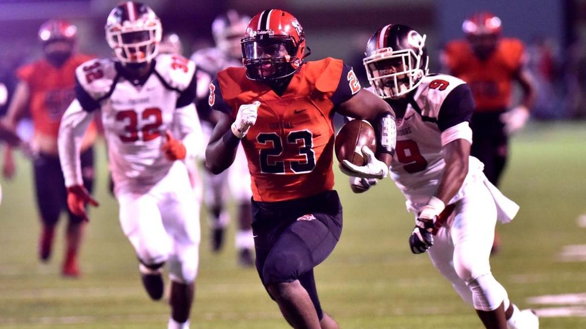 Central's Joseph McKay (23) runs for a touchdown late in the second quarter Friday night against Theodore. Central won 42-13.