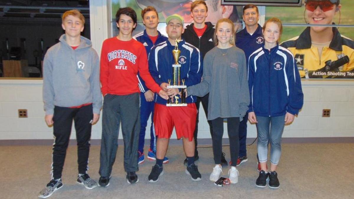 The Northside Patriots rifle team poses with their trophy after winning the First Sergeant Watson Rifle Tournament at Ft. Benning