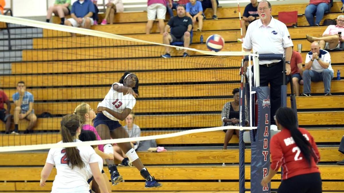 Northside's Ah’Miah Harris scores the 24th point of the third set of the state playoff match against Baldwin on Thursday, October 12, 2017.