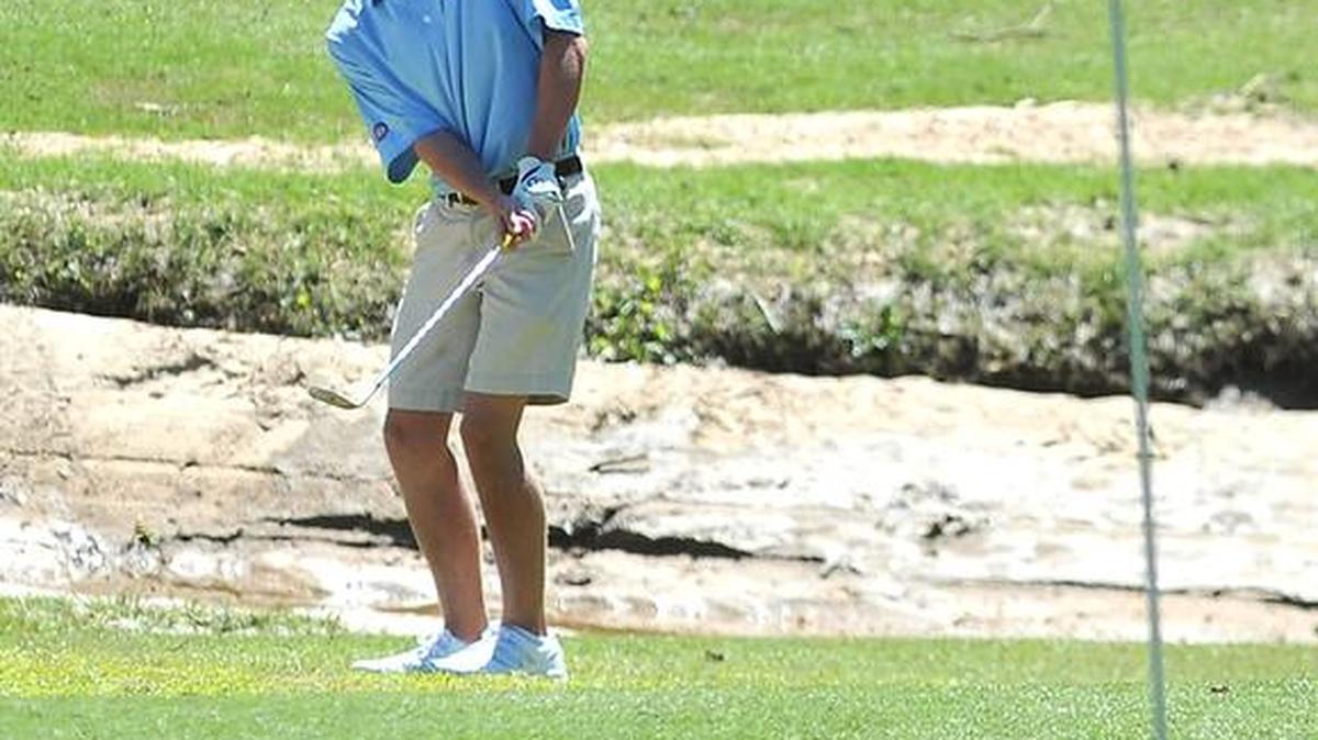 Columbus’ Ben Carr hits a chip shot on to the third green at Bull Creek Golf Course Friday during the 41st Larry Gaither Hardaway Invitational Golf Tournament.