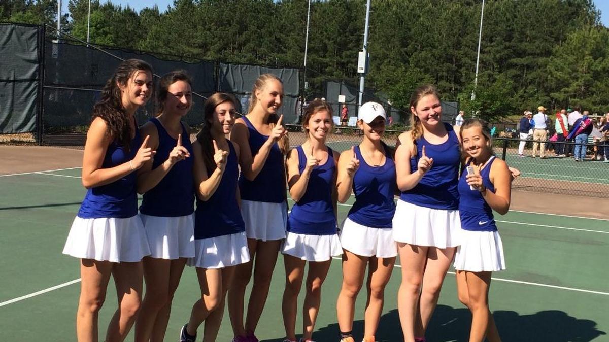 The Brookstone tennis team celebrates winning the Class A-private school state championship Saturday.