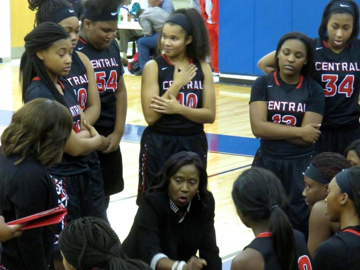 Central girls coach Carolyn Wright addresses her team in the third quarter of the team’s game against Columbus on December 21, 2017.