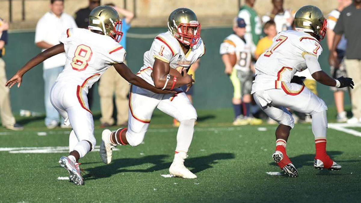 Hardaway running back Marco Lee takes the hand-off from quarterback Dominique Ford against Troup County on Thursday night, August 17, 2017