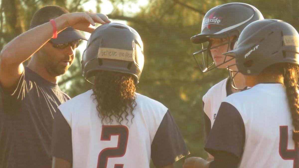 Northside head softball coach Brandon Jenkins talks with some of his hitters during the Lady Patriots’ game against Stephens County on Thursday, October 26, 2017