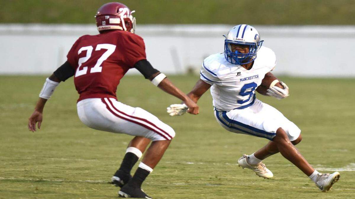 Manchester’s Kalil Brawner carries the ball against Jordan on Sept. 15, 2017 .