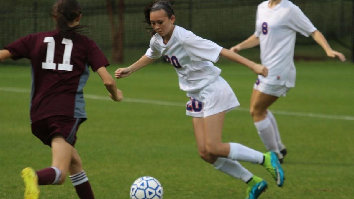 Columbus’ Kimberly May dribbles around Union Grove’s Catey Hunt in Wednesday night’s game.