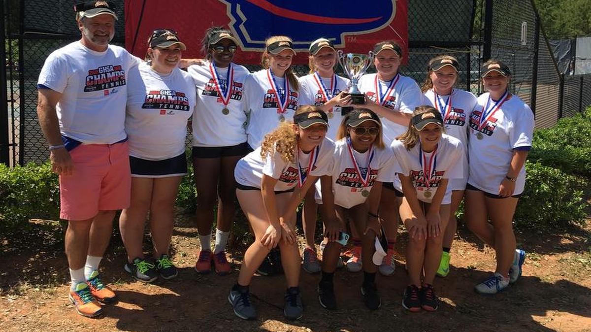 The Columbus High tennis team celebrates the program’s first state championship.