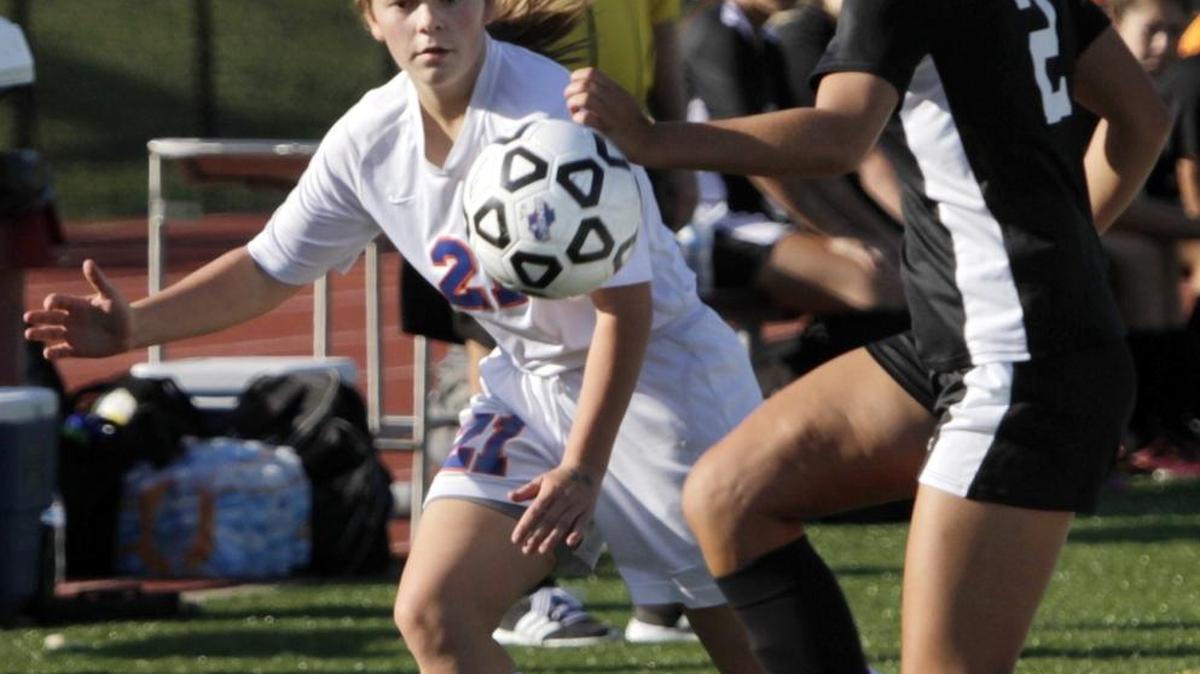 Columbus High’s Savannah Bridges and Richmond Hill’s Jada Carnine pursue the ball in the quarterfinals.