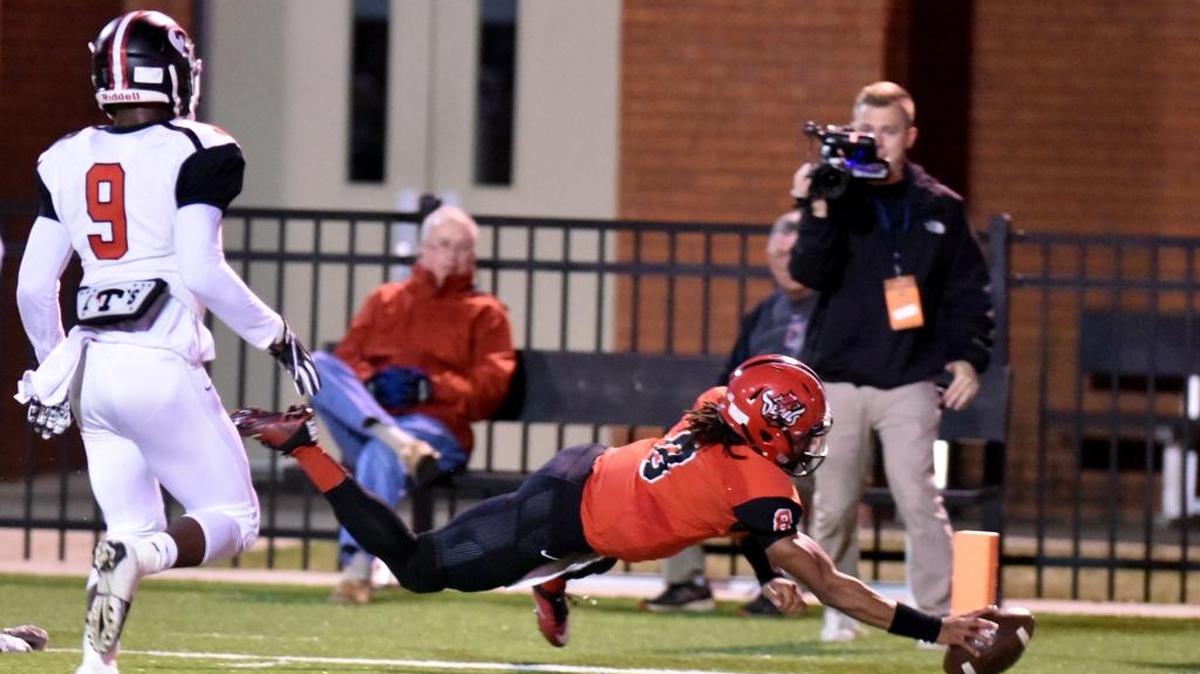 Central's Peter Parrish diving for the pylon for a touchdown in the first quarter of the game against Theodore Friday night during the first round of the Class 7A playoffs November 10, 2017