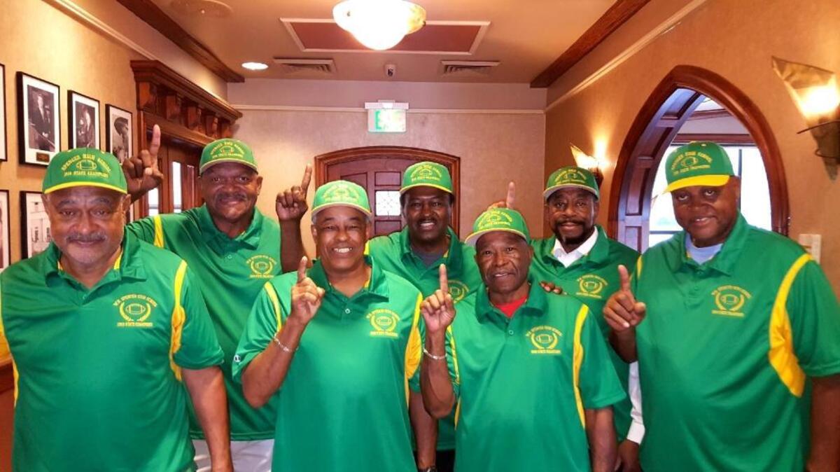 Members of the 1967-1968 Spencer football state champions Charles Deese, James “Monk” Johnson, Lamel Jordan, Willie Butler, Willie “Butterball” Williams, Herman Barnes and Bradley Ogletree pose together.