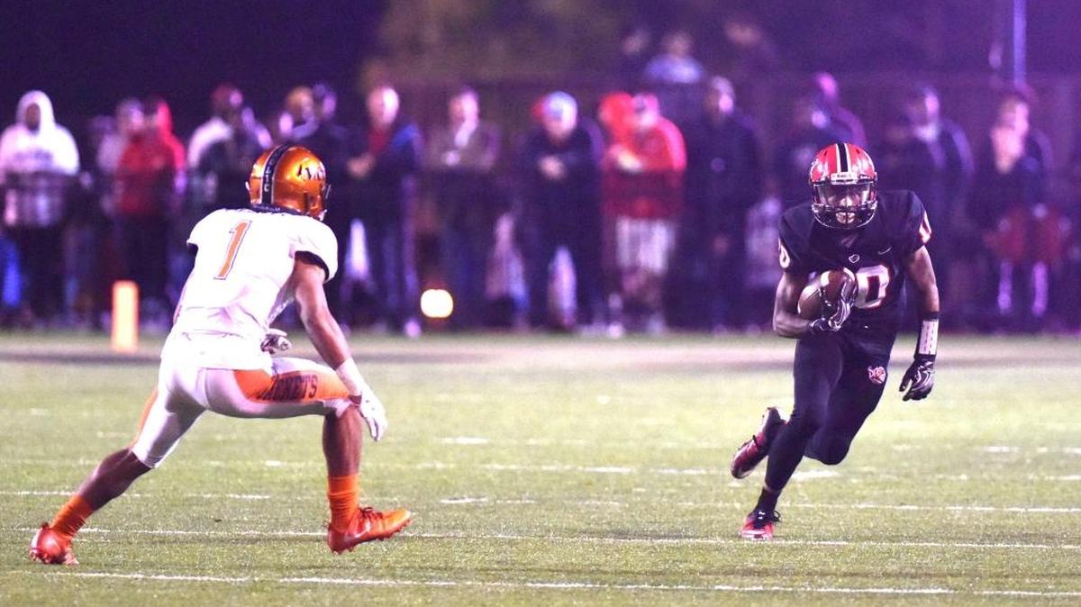 Central's Deonte Williams runs upfield with a pass reception against Bryan Hill in the second quarter of the Central Football Class 7A semifinals game against McGill-Toolen Friday night, November 24, 2017 at Garrett-Harrison Stadium.