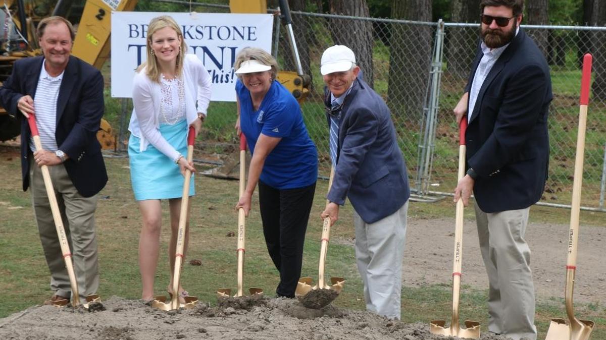 Brookstone School held a groundbreaking ceremony on the school’s campus for the Mary Lynne Smisson Cumiskey Tennis Complex. Pictured are, from left, athletic director Jay Sparks, former Brookstone tennis player Charity Calhoun, girls tennis coach Mary Lynne Cumiskey, boys tennis coach Jim East and former Brookstone tennis player Scott Jones.