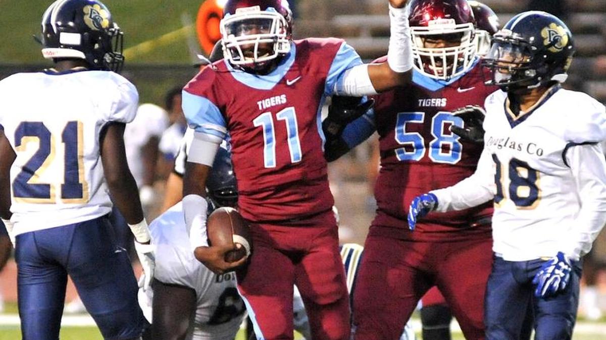 Carver’s Travis Brookins signaling a 1st down against the Douglas County defense in the 1st quarter of the game Friday night at Kinnett Stadium
