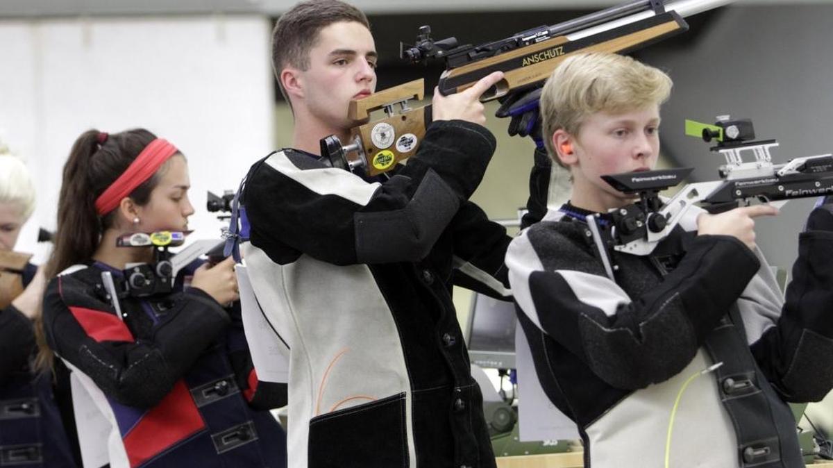 Northside High’s Jade Gallahair, left, and Drew Rogers, and Columbus High’s Jared Eddy prepare for competition to begin in the standing portion of their relay during the 2016 GHSA state rifle championships at Poole Range on Fort Benning Saturday. Eddy qualified in the top eight to compete in a final round for the individual championship. He finished sixth.