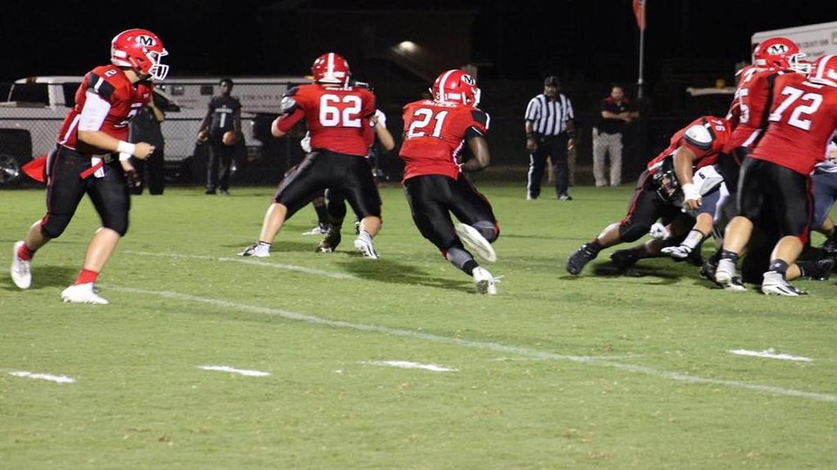 Marion County running back Travon Matthews (21) played the role of hero for the Eagles on Friday.