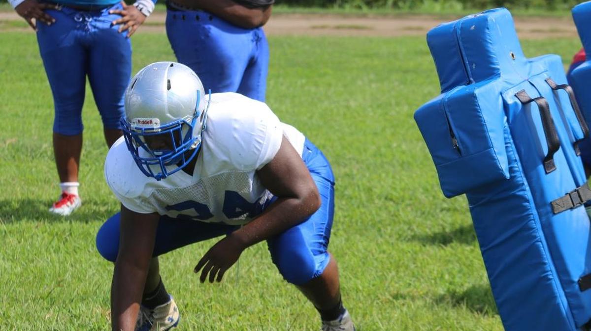 Manchester defensive end T.J. Mason works through drills on Monday at practice.