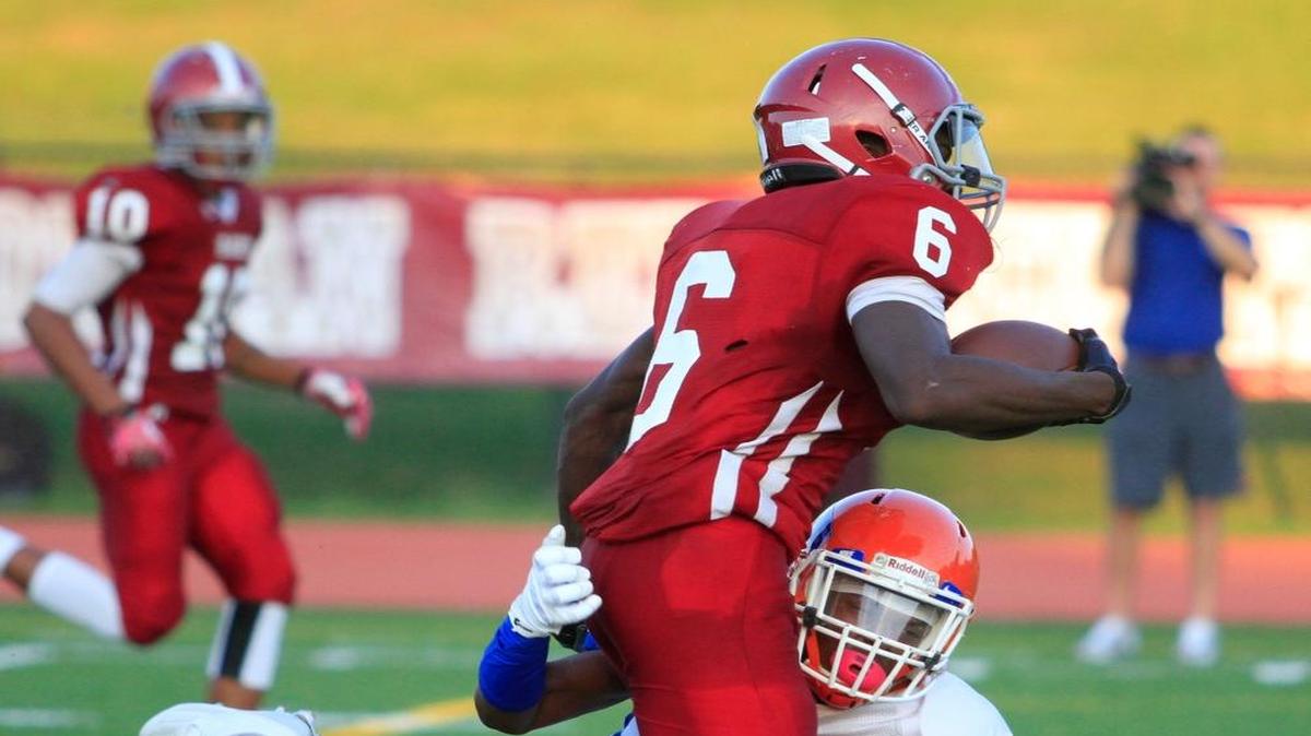 Jordan’s Aaron Maxwell is tackled by Columbus High’s Ray Thornton in a game earlier this season.