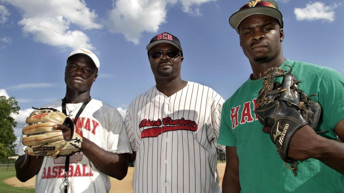 The Anthony baseball family, from left, Sam,18, father Eric Anthony and Josh Anthony, 20, stand at the Edgewood Park Little League fields where the boys’ playing days began. Sam is a 2016 Hardaway graduate, Josh will play for Auburn and Eric coaches the Black Crackers travel ball team.